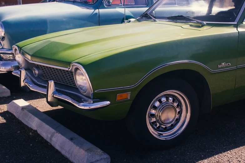 a green car parked on the side of a road