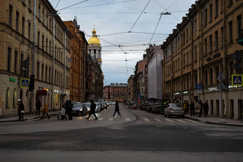 a pedestrian crossing in the middle of a city