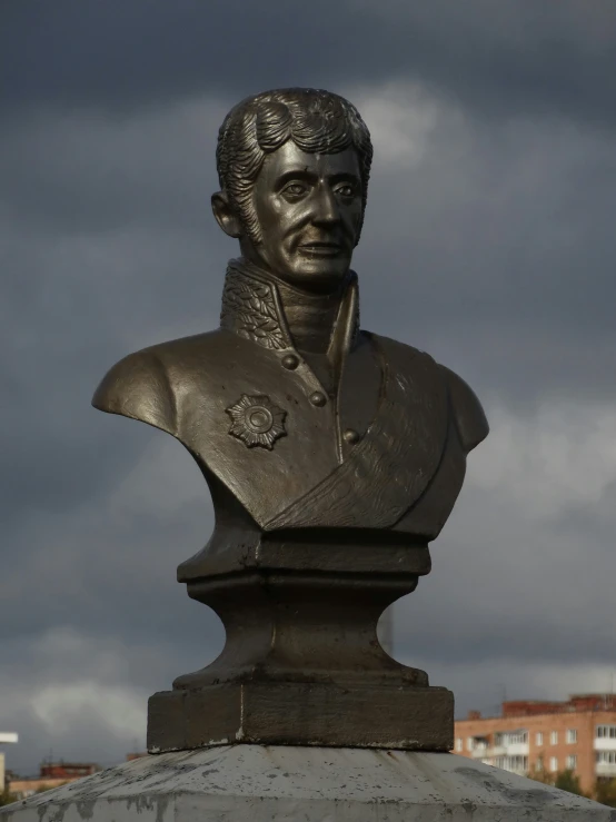 this bust is placed above the base of a monument