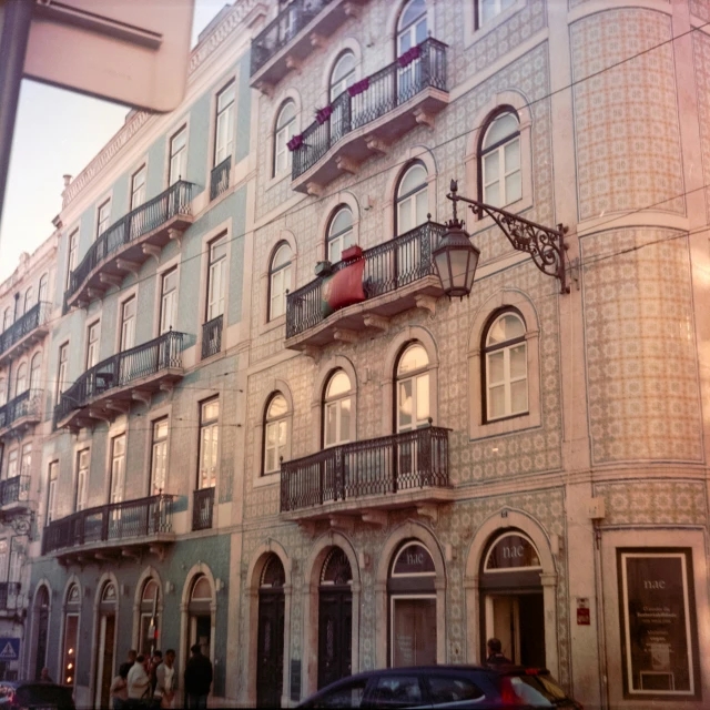 an old building with balconies on the top of it