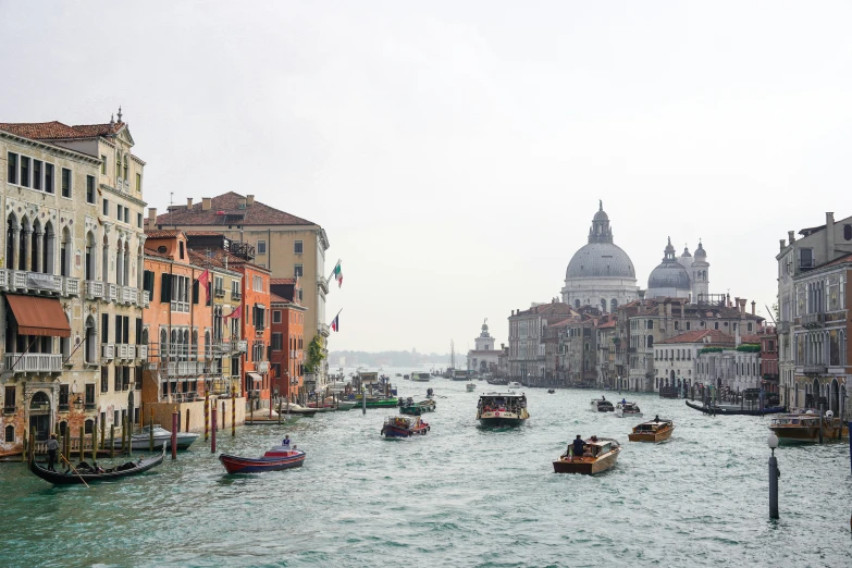 an image of a canal filled with many boats