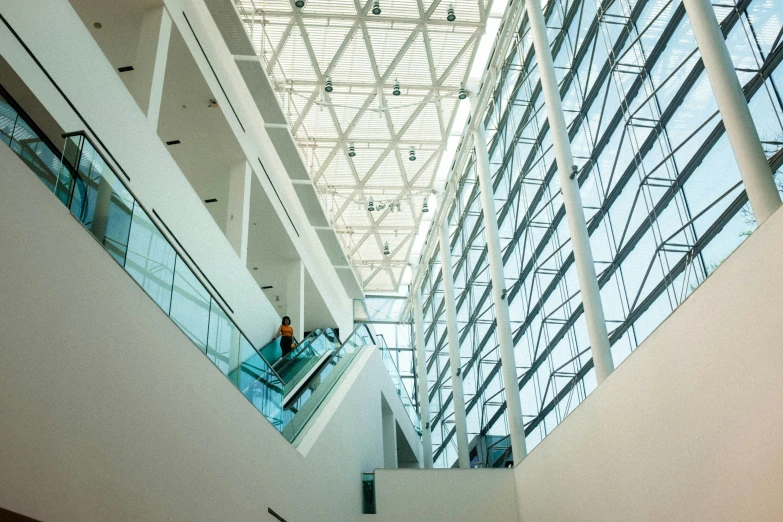 the ceiling in a modern building is filled with people