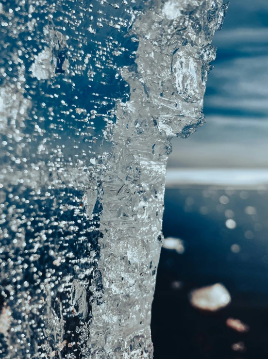 water coming out of the ocean into blue skies