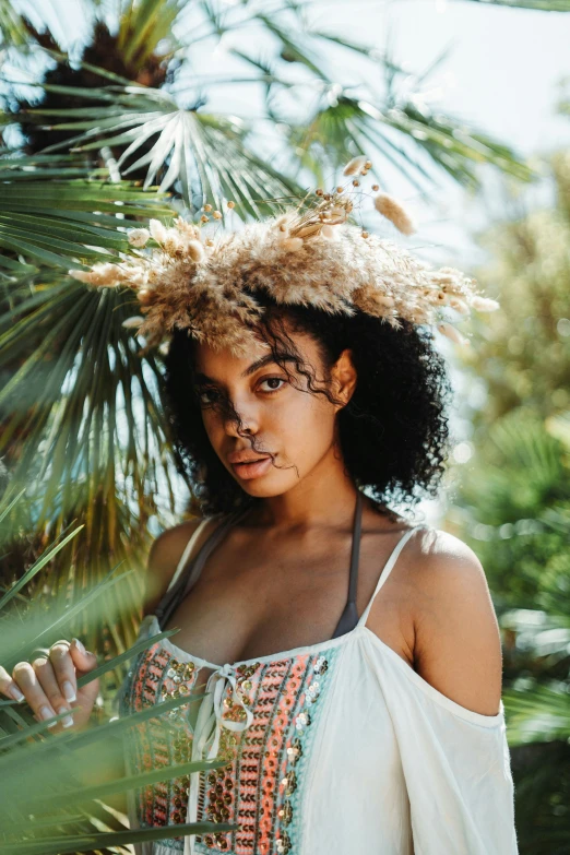 a woman with a flower crown on her head