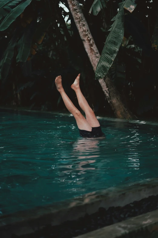 a person is laying down in the water