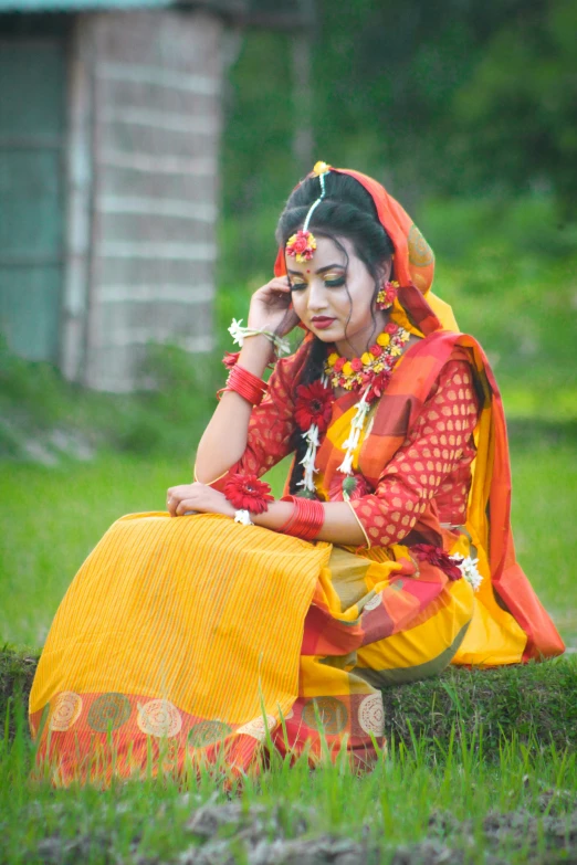 a woman in an indian costume on the phone