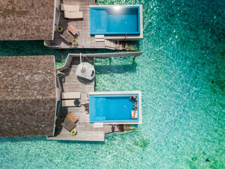 aerial view of two floating pools and dock