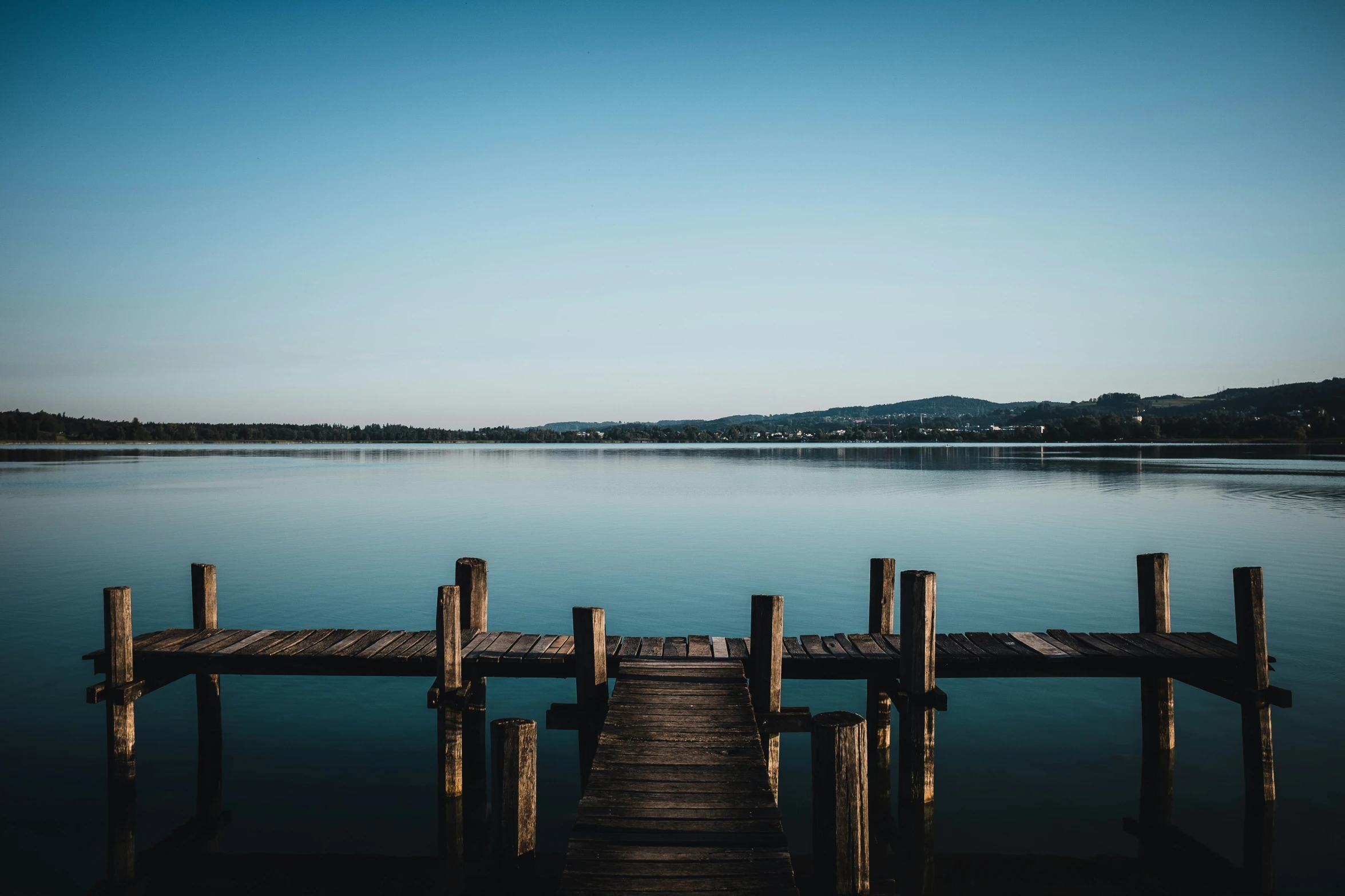 a long dock on a large body of water