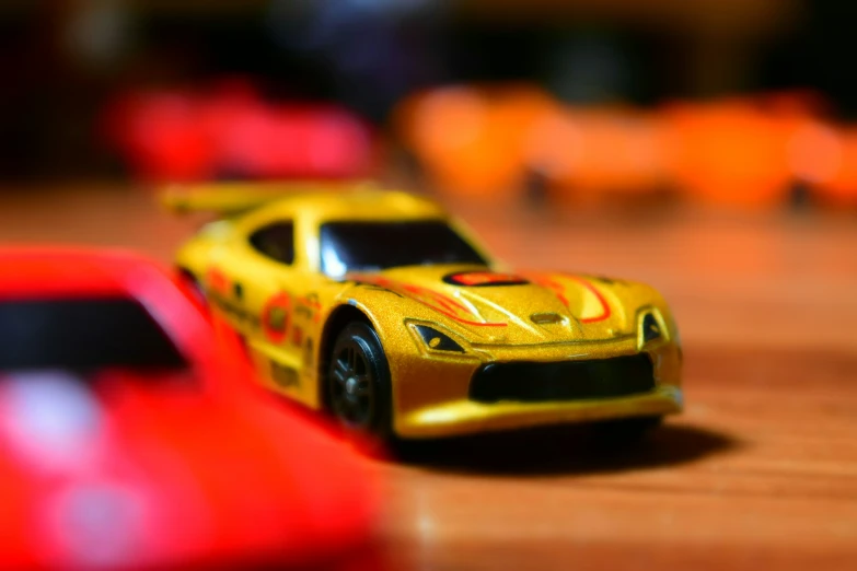 two toy cars on a table close up