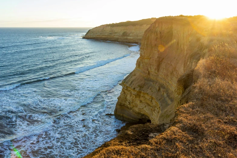 a picture of the ocean looking down at the cliffs