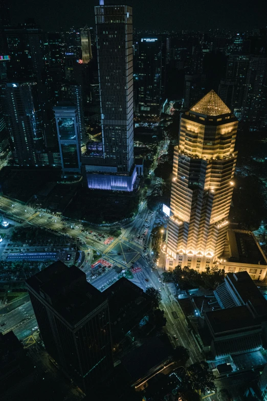 view of illuminated buildings in a busy city at night