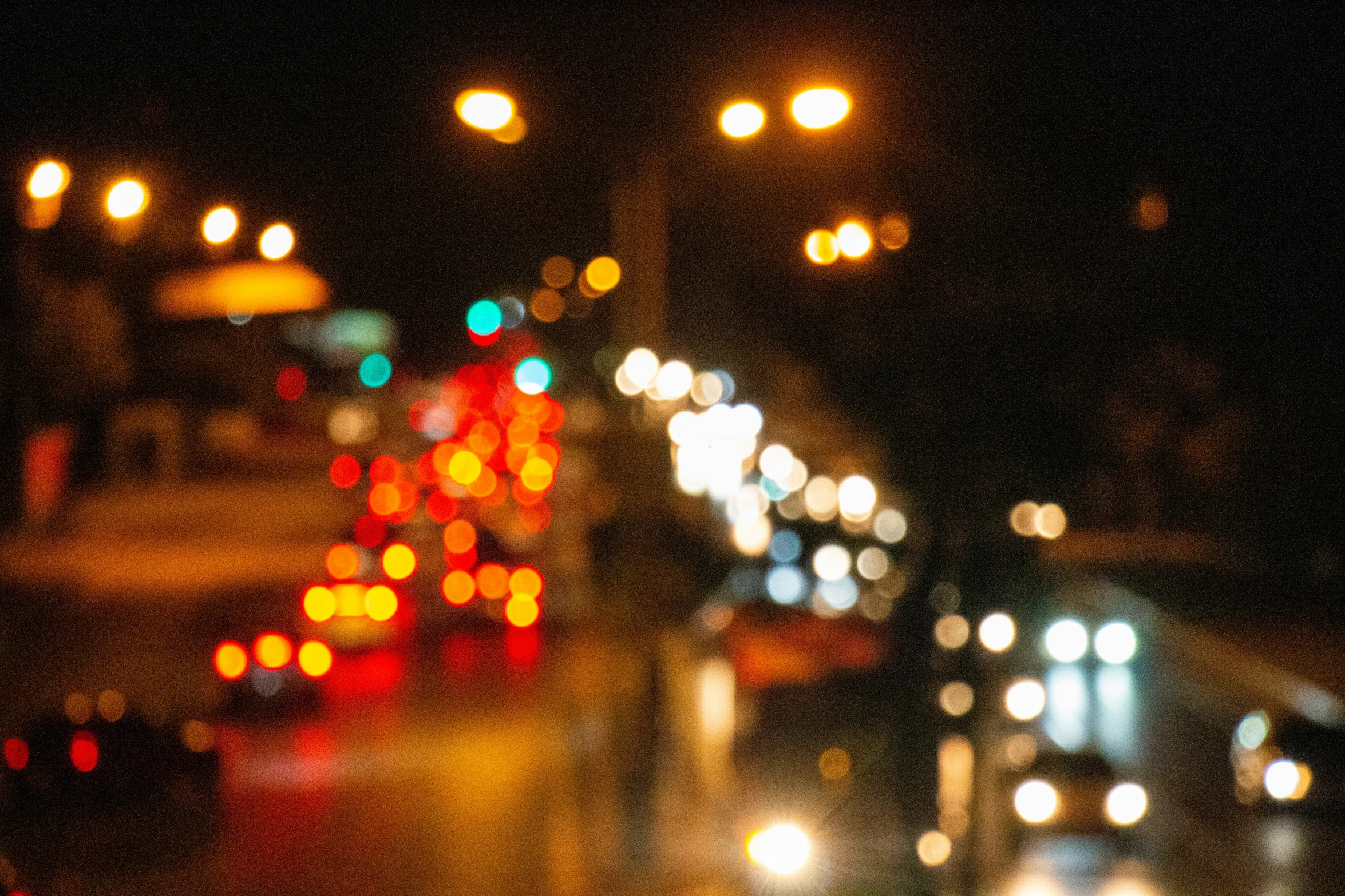 a blurry view of the lights from an outside city at night