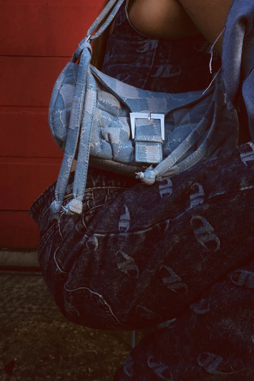 a person holding a purse that has small pockets