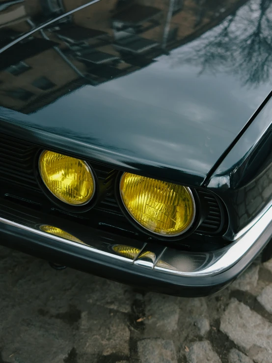 the taillights of an old black car