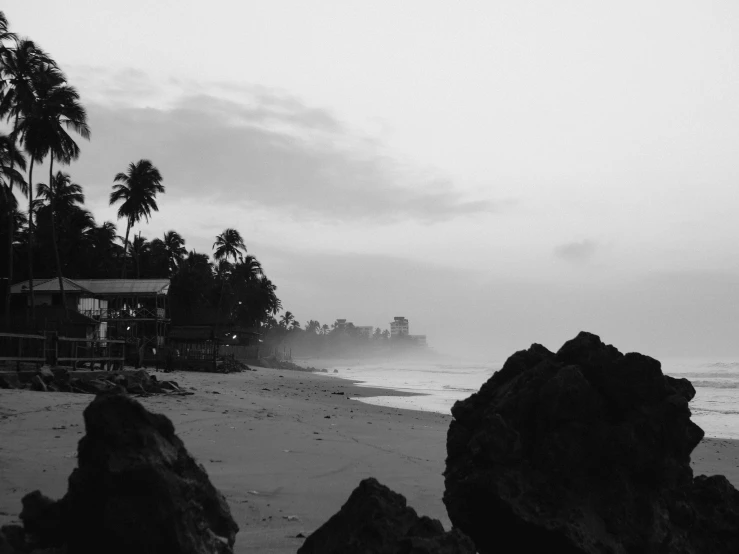 a black and white view of the ocean waves