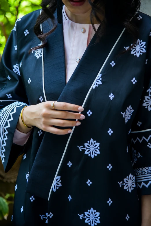 a close up po of a woman wearing an oriental outfit