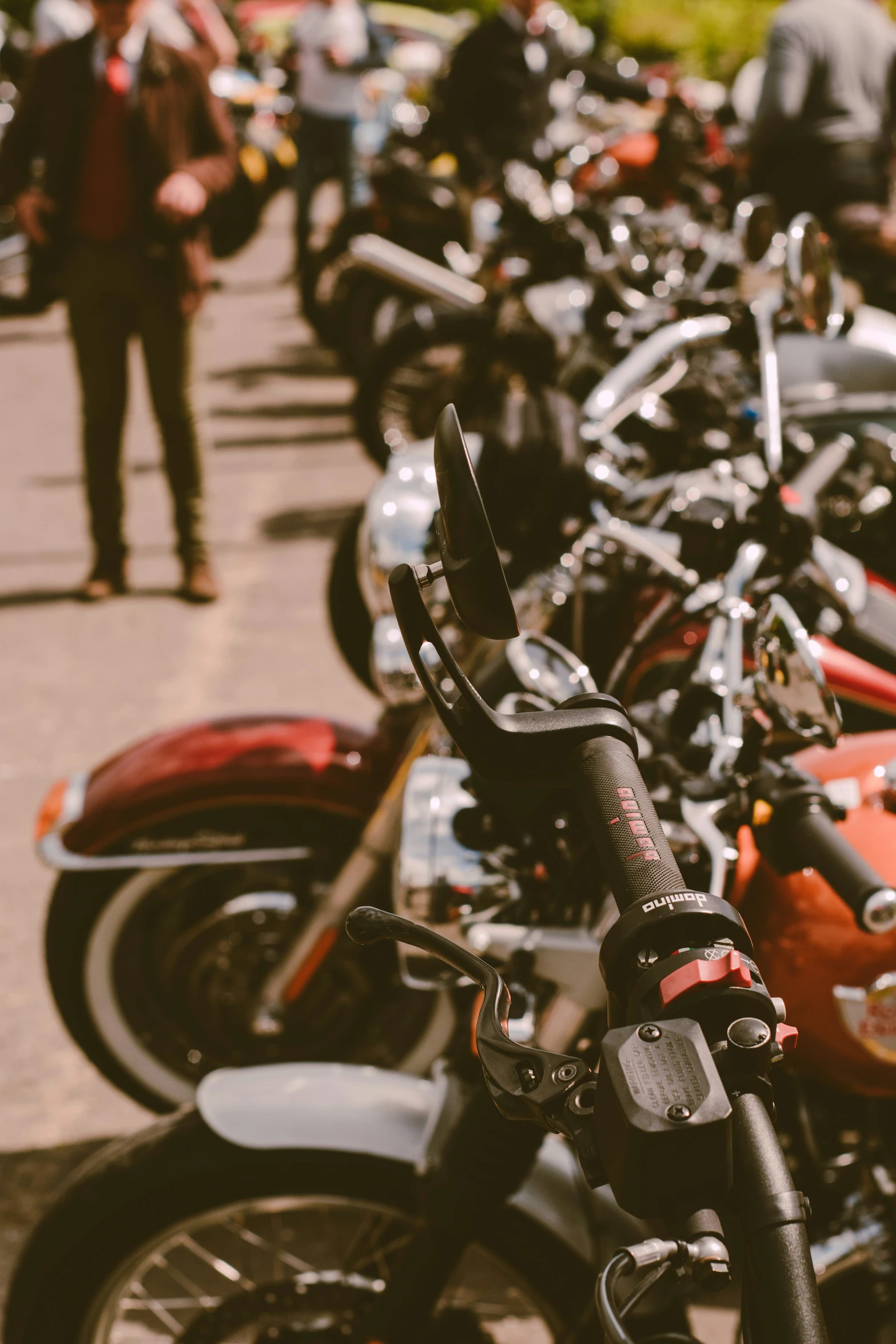 many motorcycles are shown lined up on the pavement