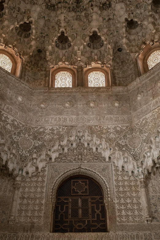 a wall with some windows and lights hanging from it