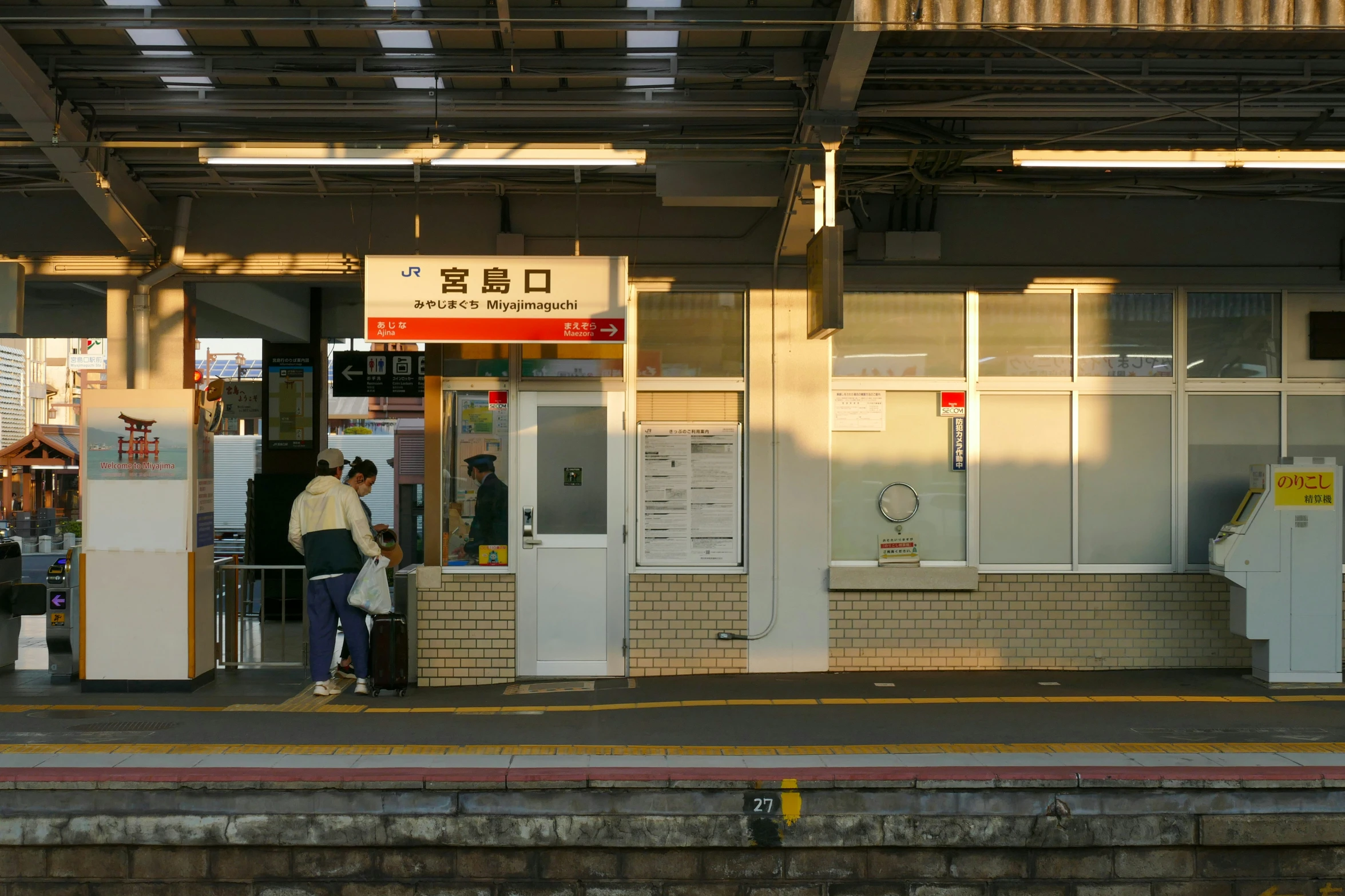 people standing in front of a door with their backs turned