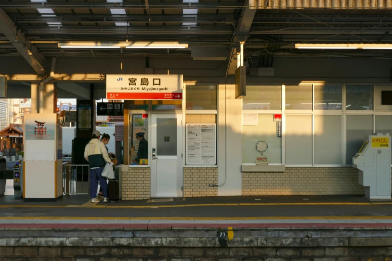 people standing in front of a door with their backs turned