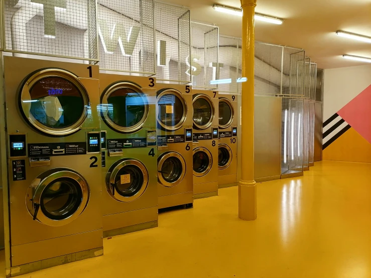 multiple machines with different types of washers in front of them
