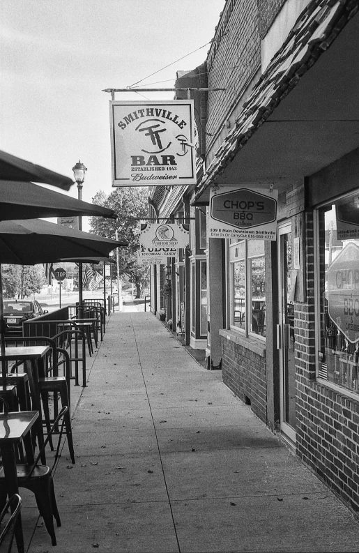 the outside of an outdoor restaurant with chairs