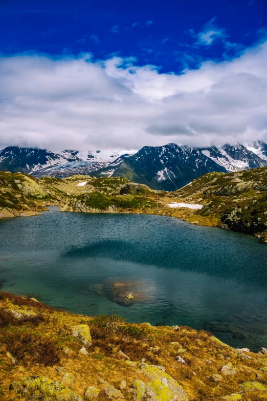 some water and some mountains with a small lake