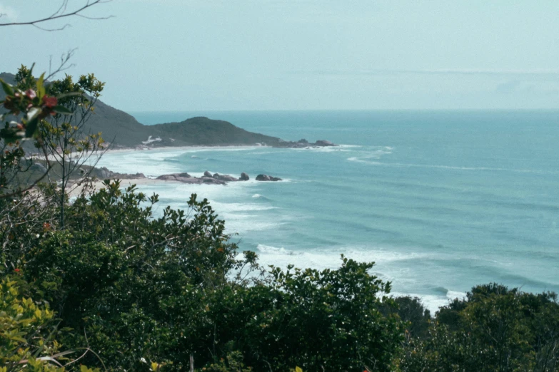 a scenic po of the ocean and a rocky beach