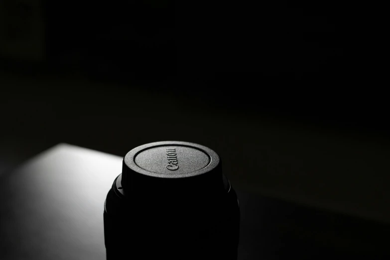 a can in a dark room with a light on