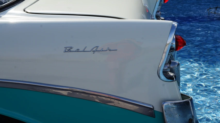 a small car with the word belfoath written in cursive font on it