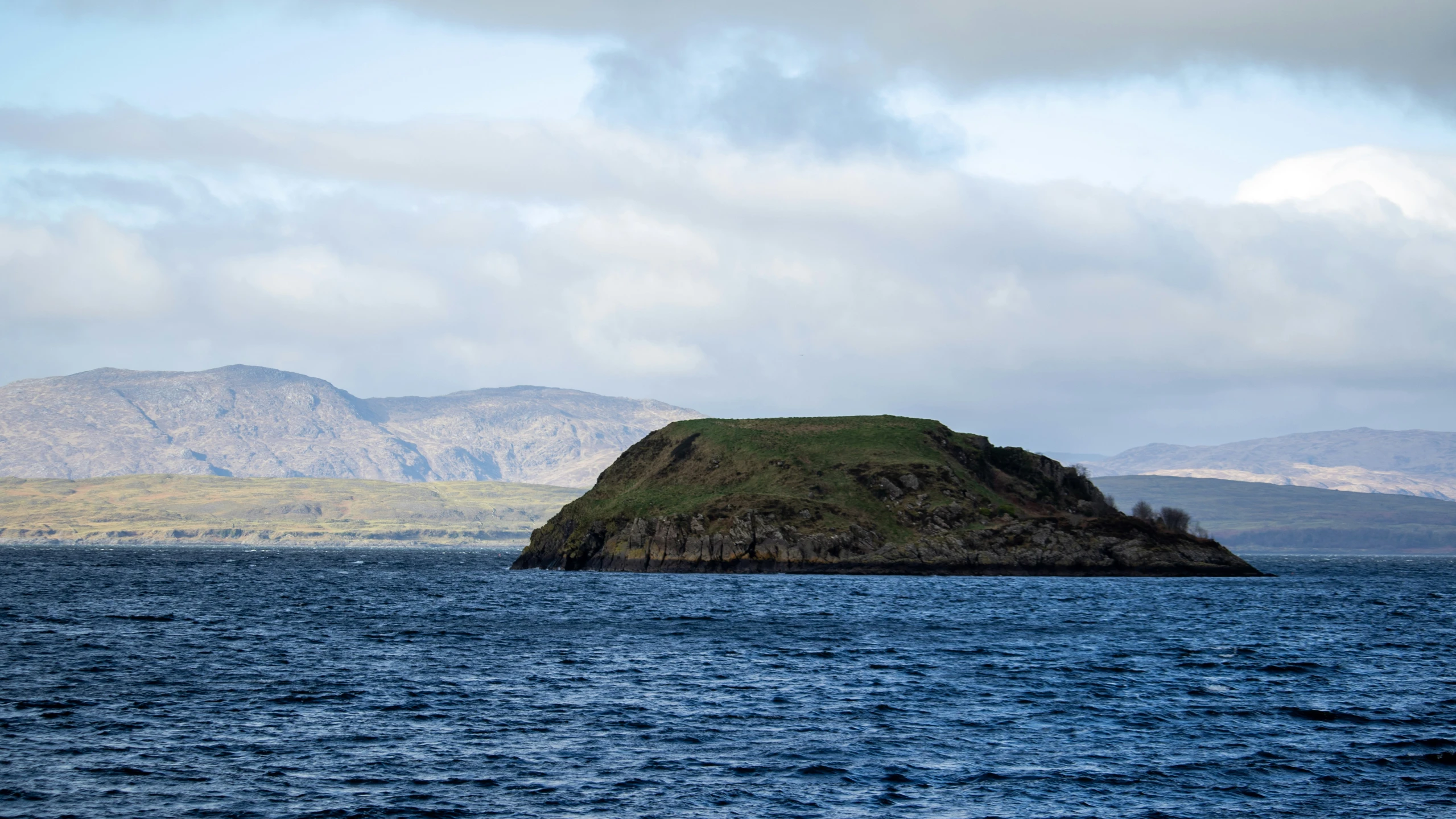 an island sitting in the middle of a lake