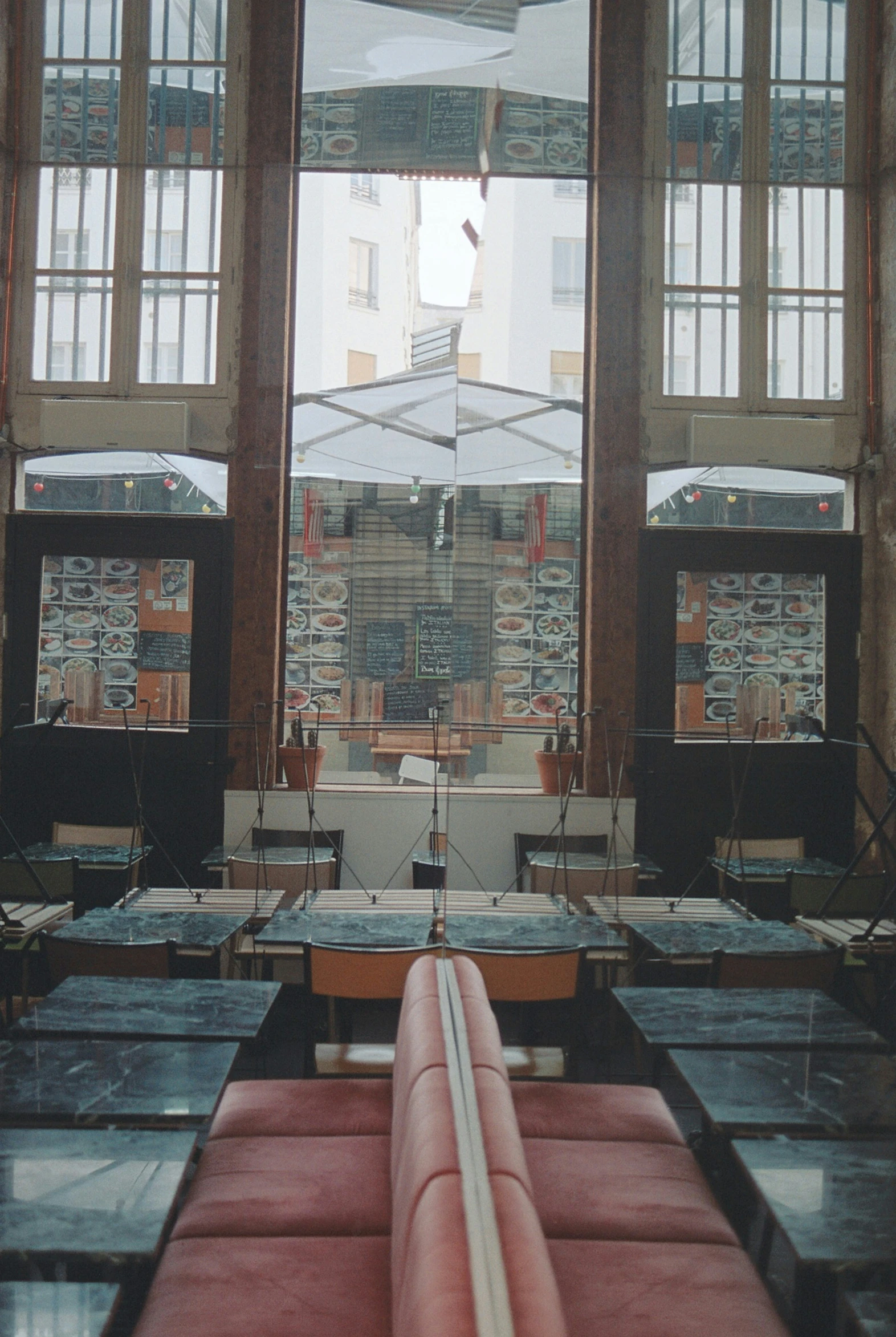 the inside of a building with two large windows