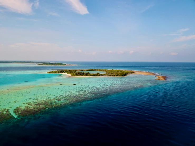 an aerial view of an island in the middle of the ocean