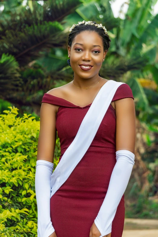 a woman wearing gloves, standing outside