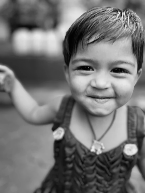 a black and white po of a little girl making a face