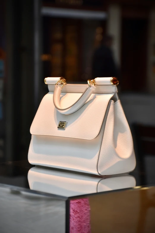 a white bag is displayed at the entrance of a building