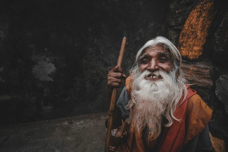 an old man standing with a long white beard