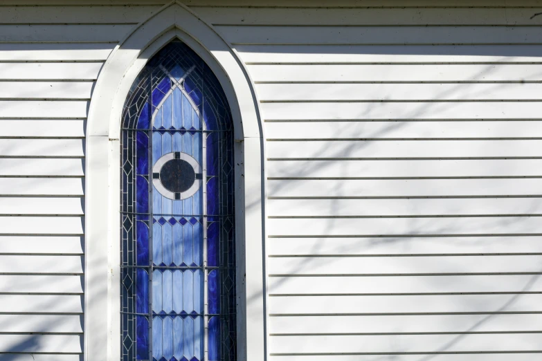 a picture of a blue and white stained glass window