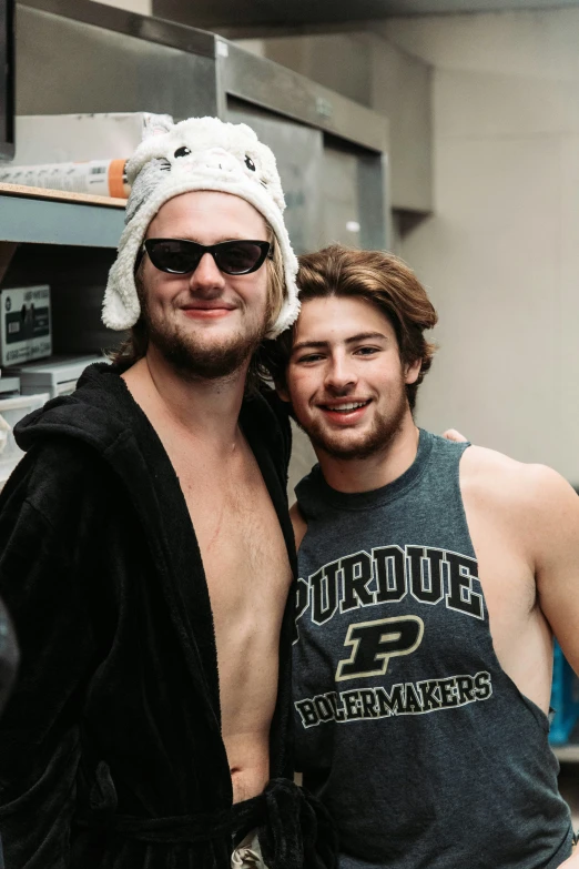 two men are smiling and posing for a po