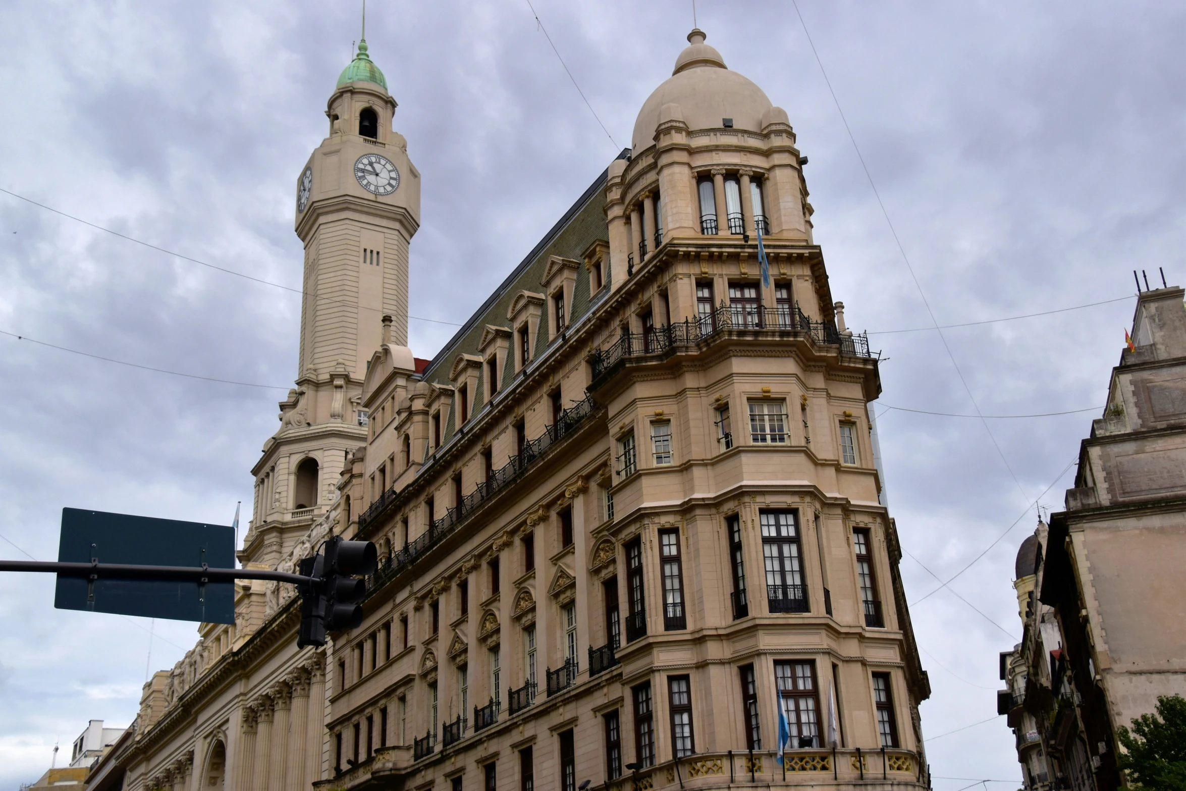 a large brown building with a clock on the top