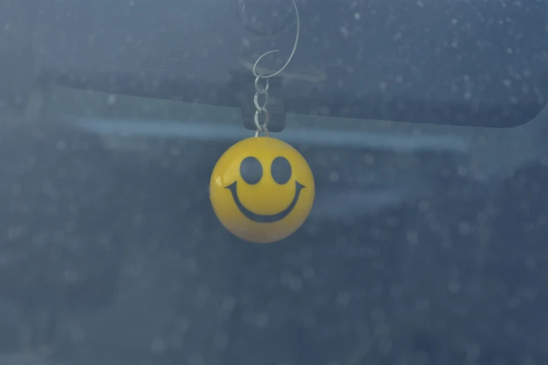 an image of smiley face yellow on on the side of a vehicle