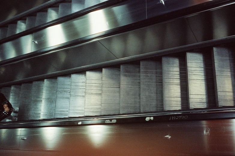 a woman standing in a doorway with her luggage