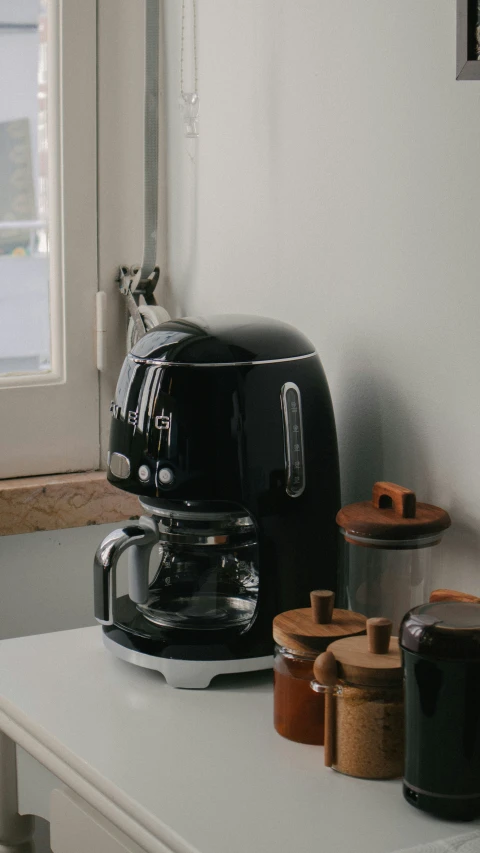 a coffee pot sitting on top of a counter
