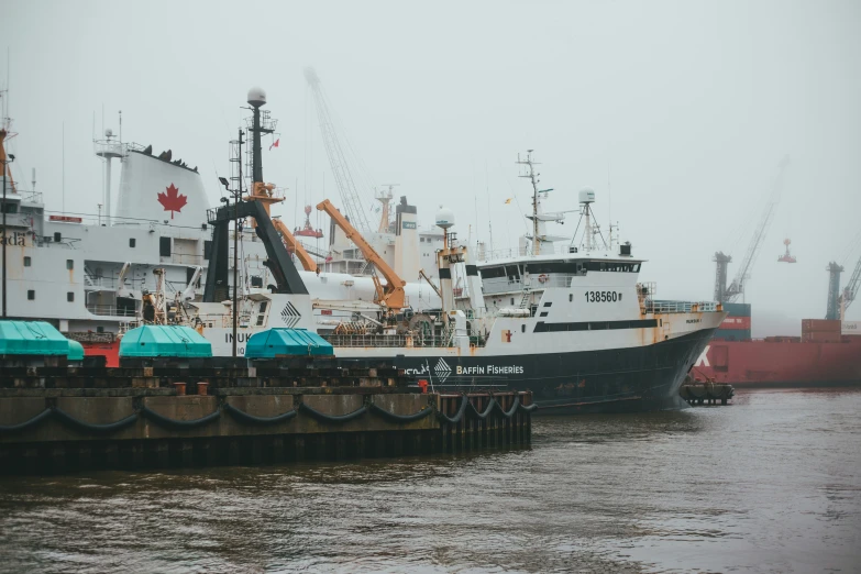 a large cargo ship sits docked in the water