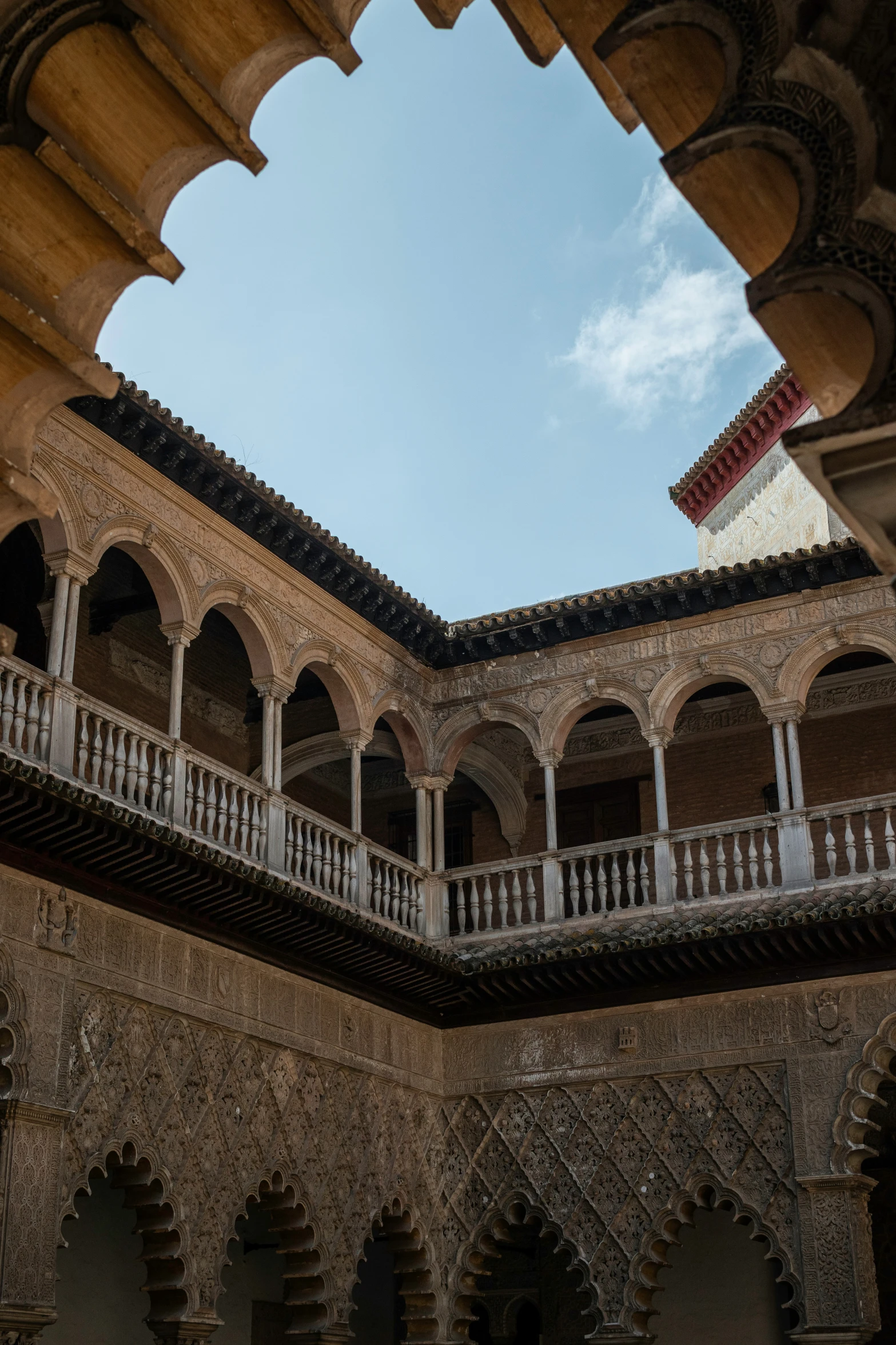 a view from below, with large arched doorways and arches