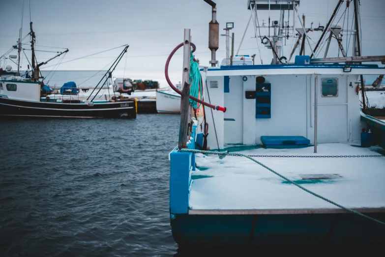 boats are moored at a dock as they travel the ocean