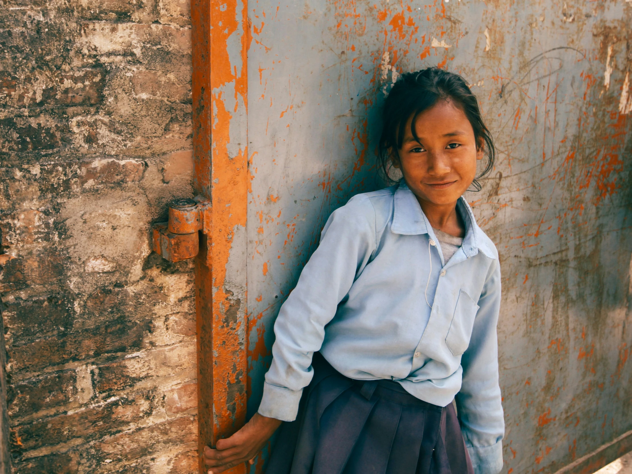 a  leaning against an old wall