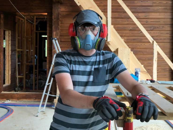 man with protective gear on inside a construction site