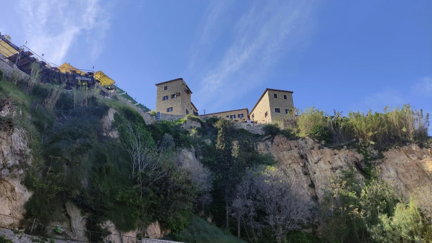 a hill with a castle on it's top of it