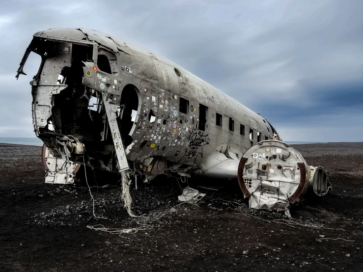 a destroyed airplane is in a barren area